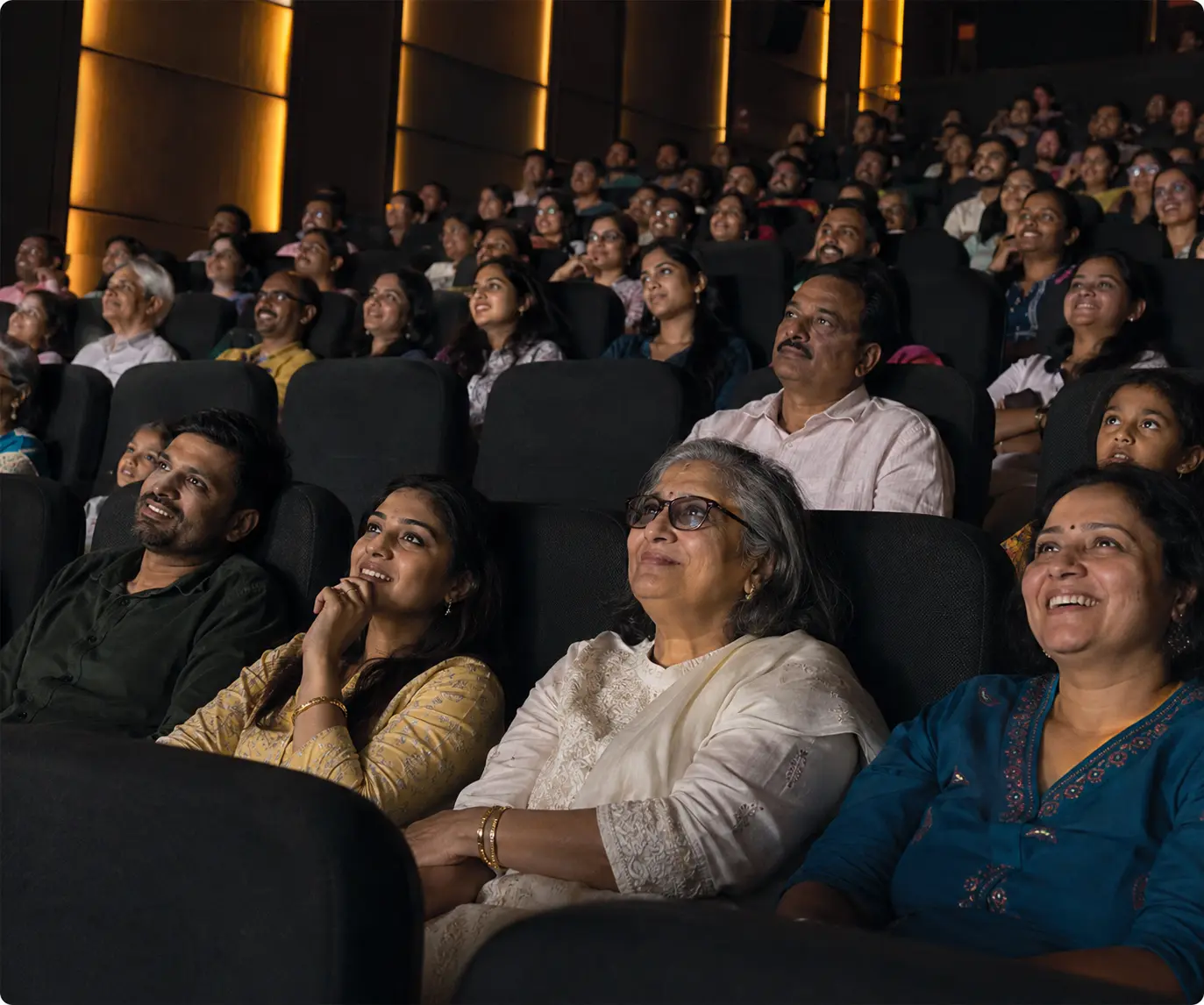 Audience enjoying a film together in a cinema