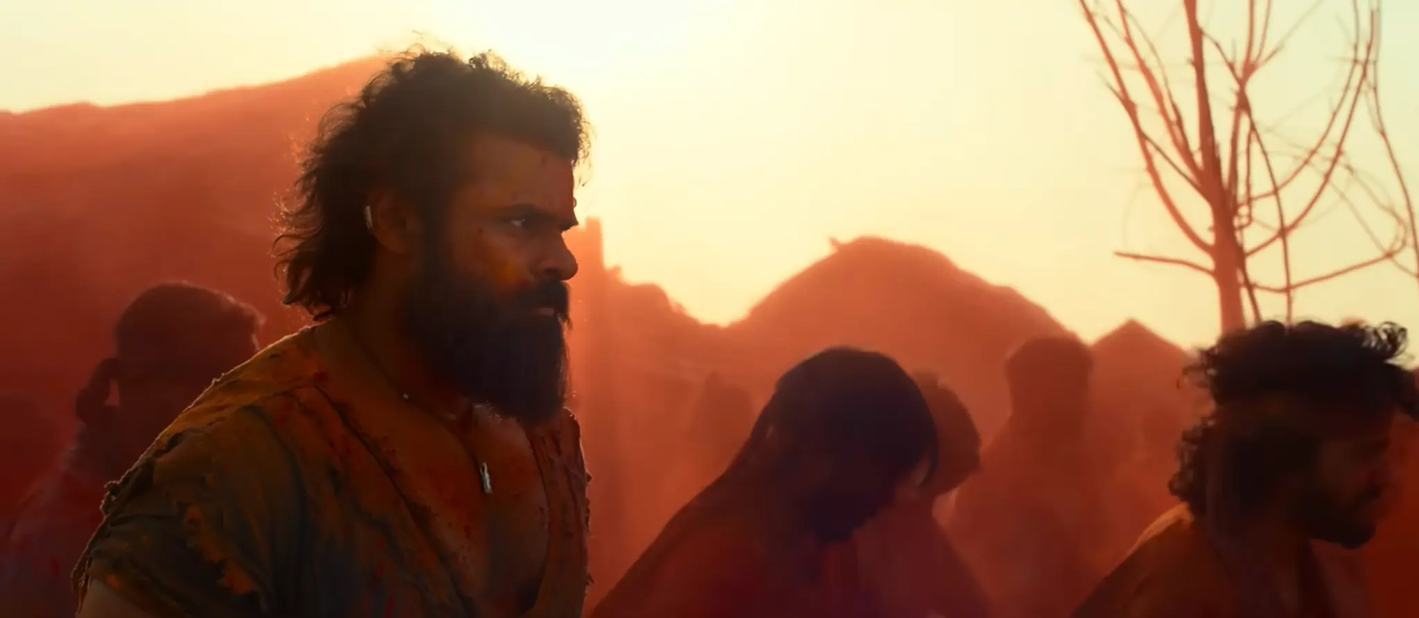 SYG character standing amid a sunlit red-dust gathering