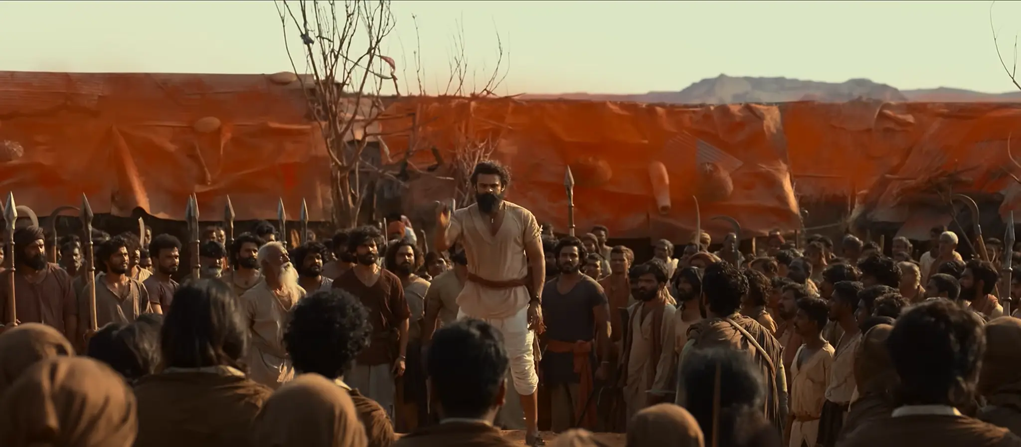 SYG character addressing a gathered village crowd